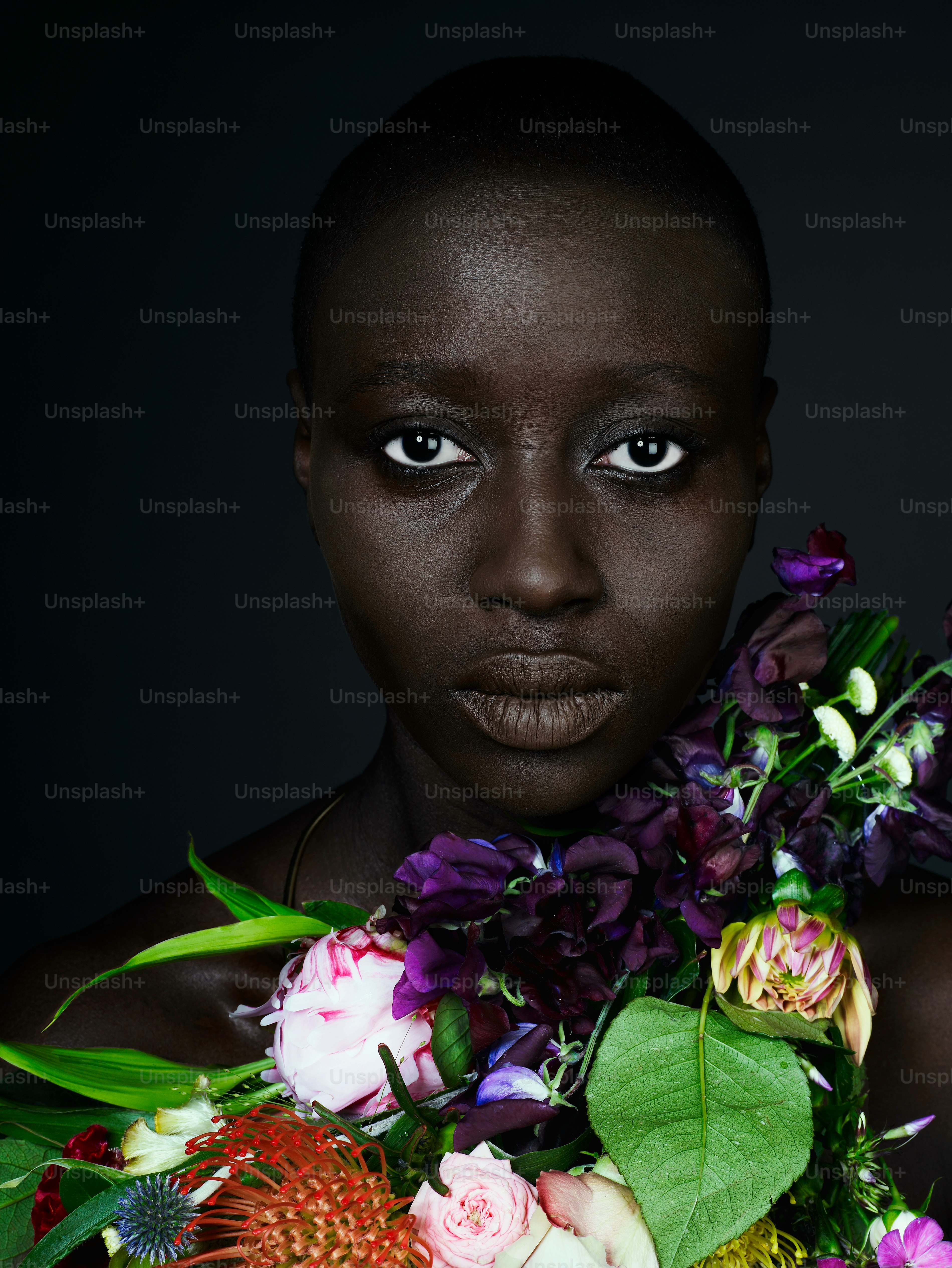 a woman is holding a bouquet of flowers