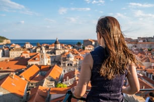 Woman traveller at Dubrovnik Old Town, in Dalmatia, Croatia - The prominent travel destination of Croatia, Dubrovnik old town was listed as UNESCO World Heritage Sites in 1979.