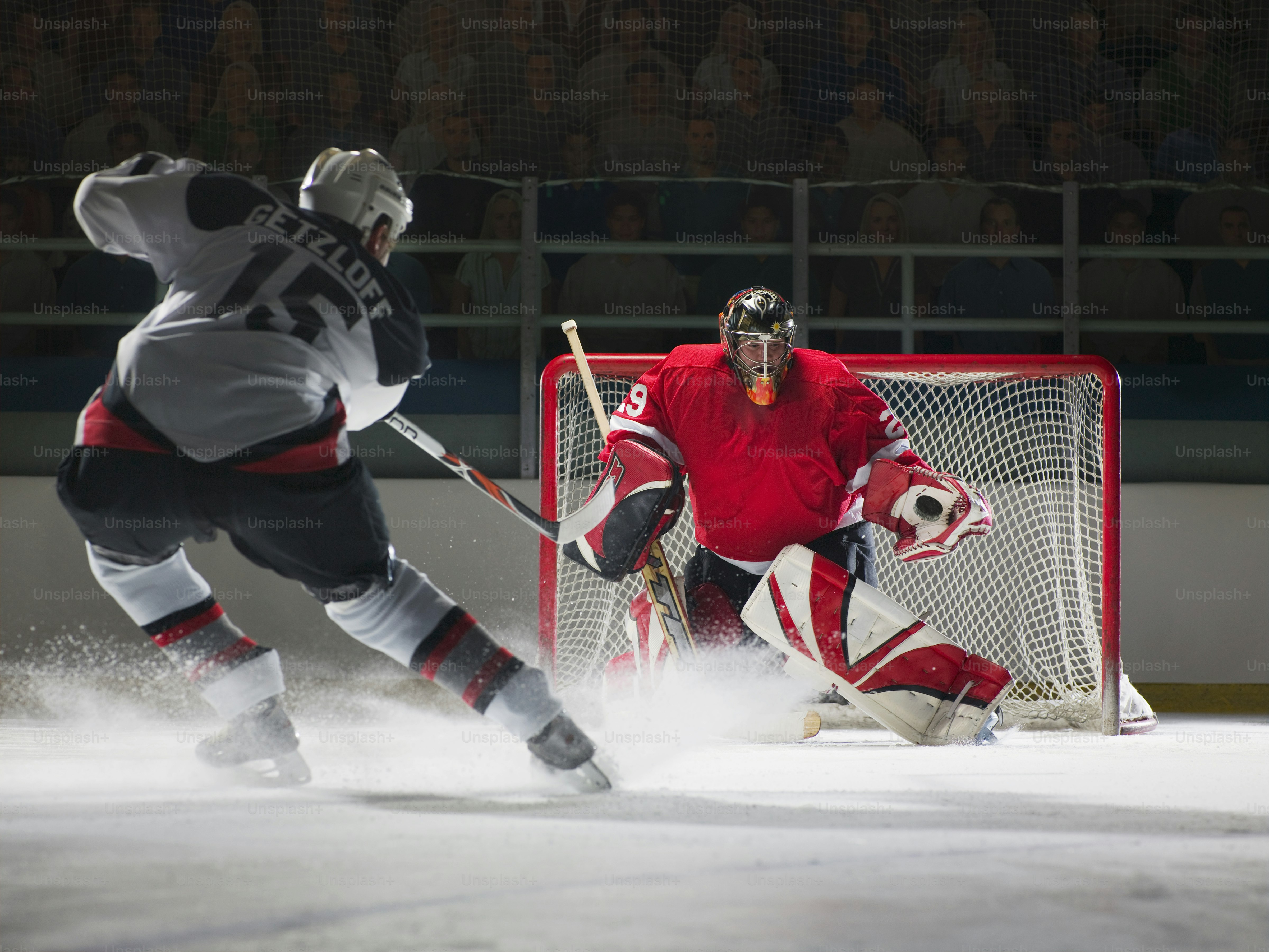 A group of men playing a game of ice hockey photo - Challenge Image on ...