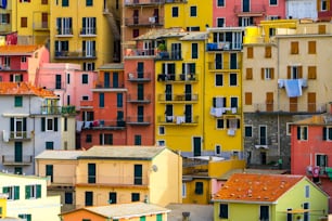 Colorful houses in Manarola Village, Cinque Terre Coast of Italy. Manarola is a beautiful small town in the province of La Spezia, Liguria, north of Italy and one of the five Cinque terre attractions.