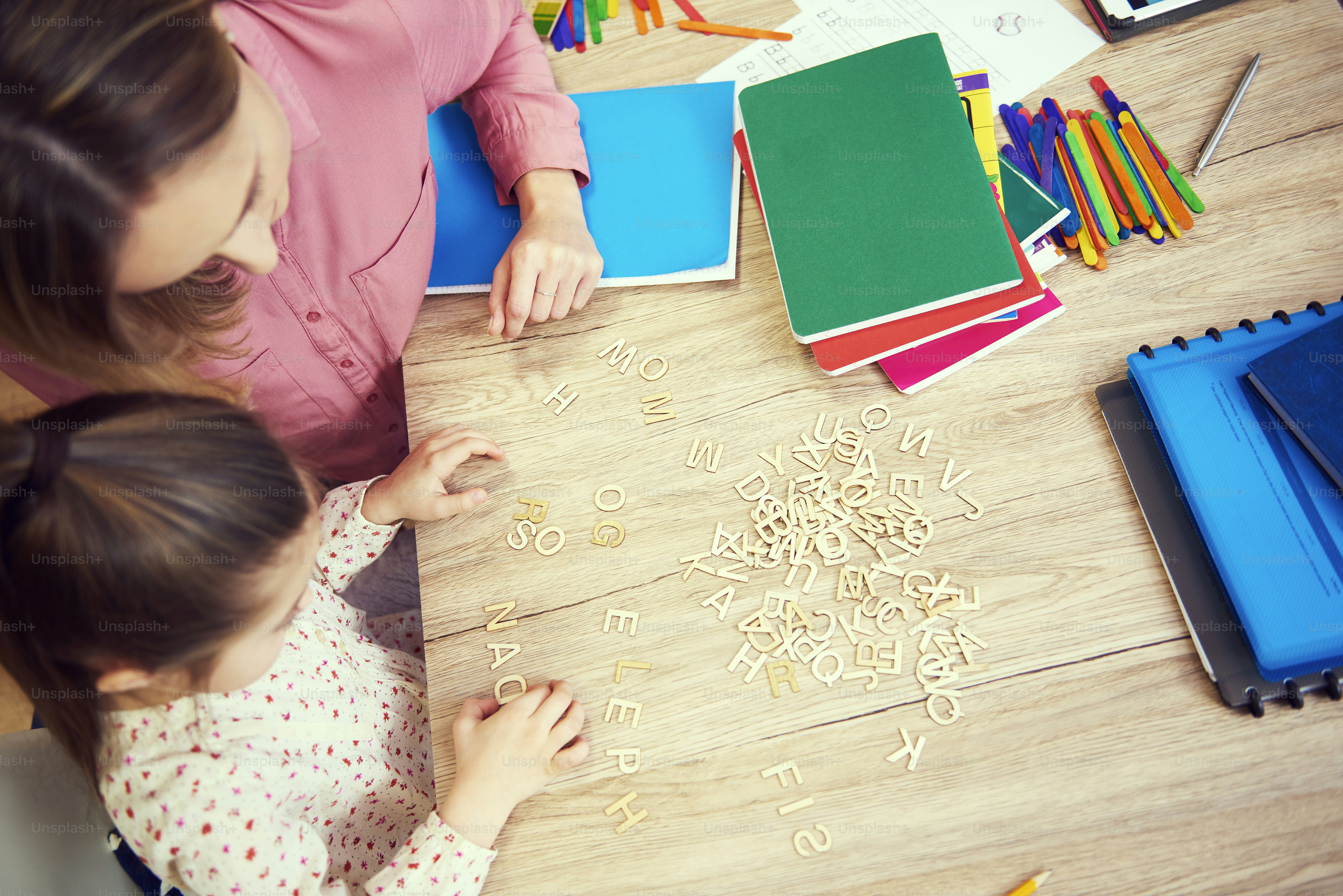 Girl learning the alphabet at home