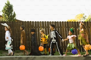a group of children dressed up in halloween costumes