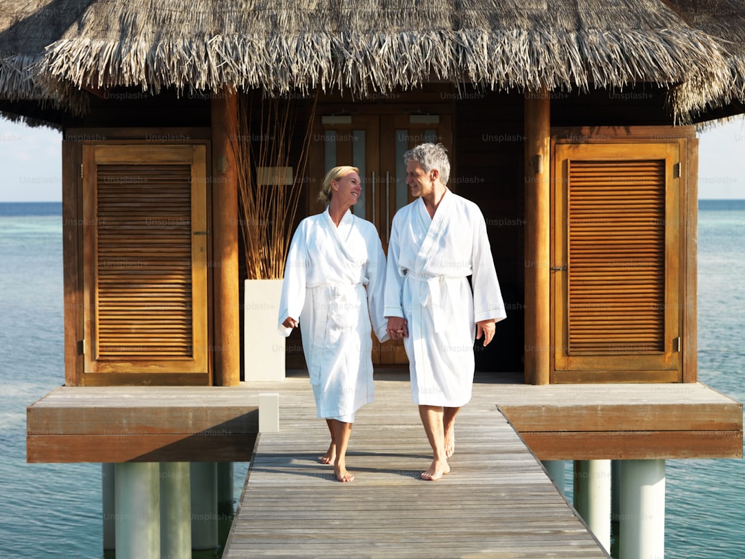 a couple of people that are standing on a dock