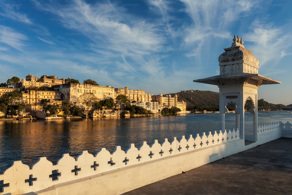 India luxury tourism concept background - Udaipur City Palace from Lake Pichola. Udaipur, Rajasthan, India