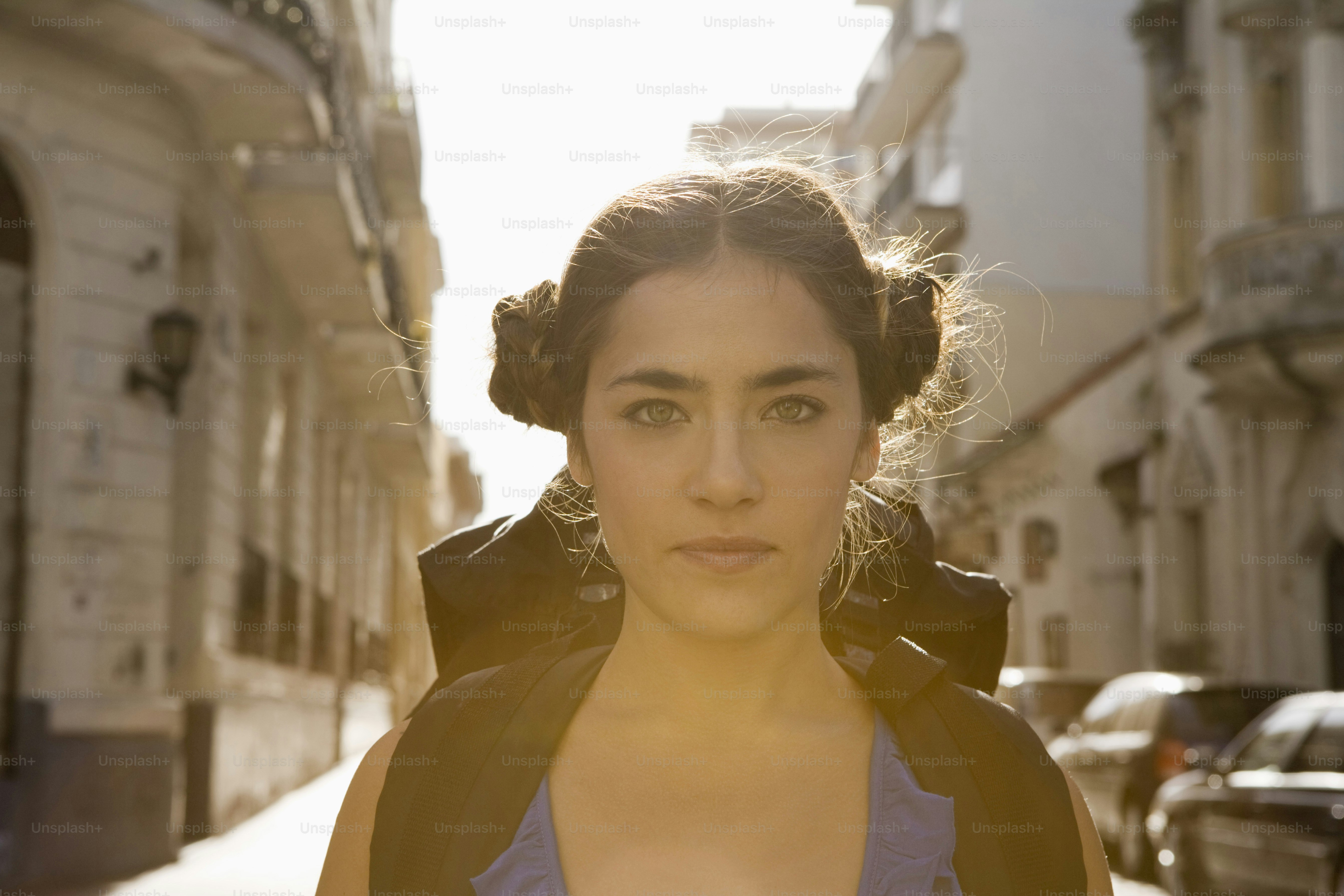 a woman standing in the middle of a street