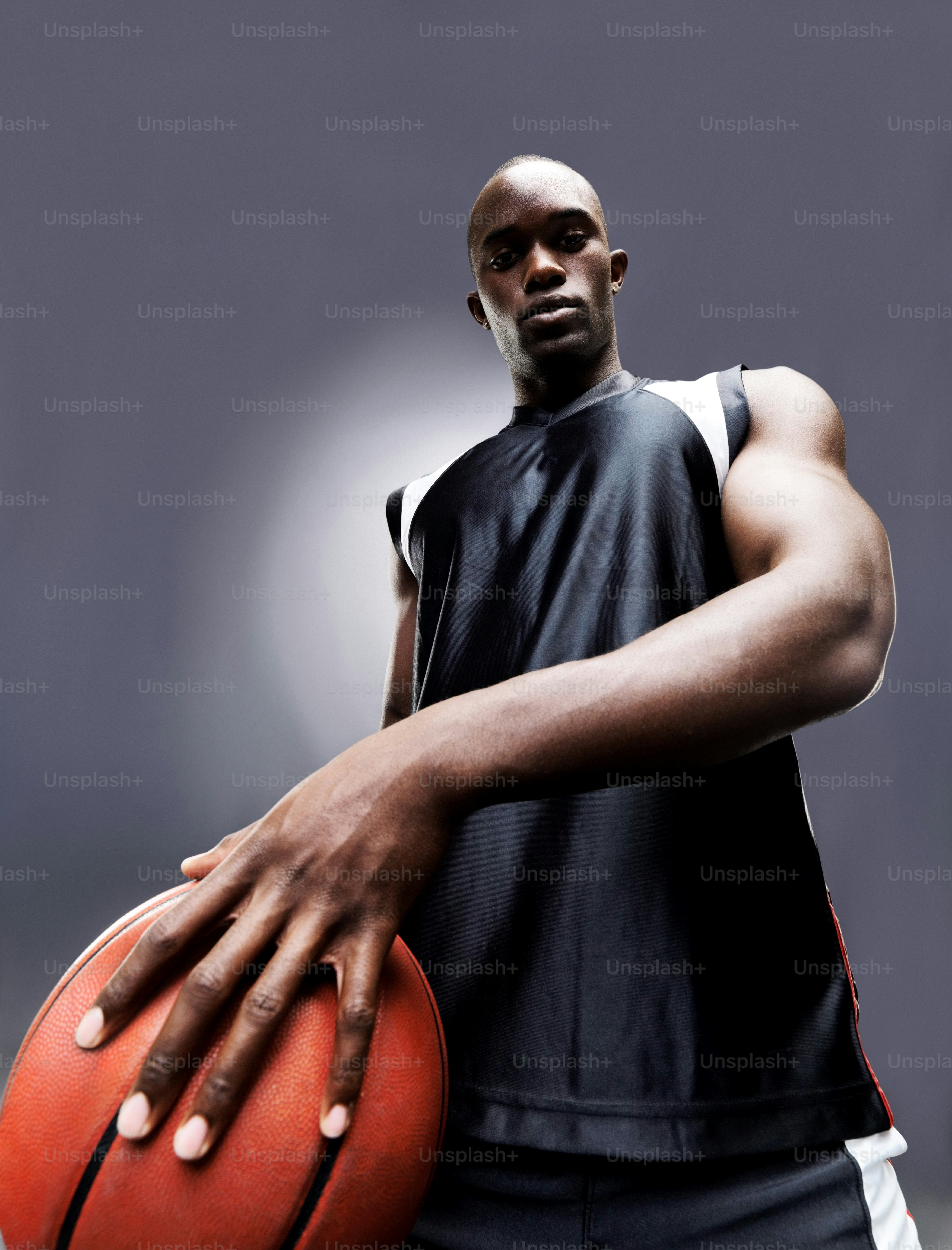 a man holding a basketball in his right hand