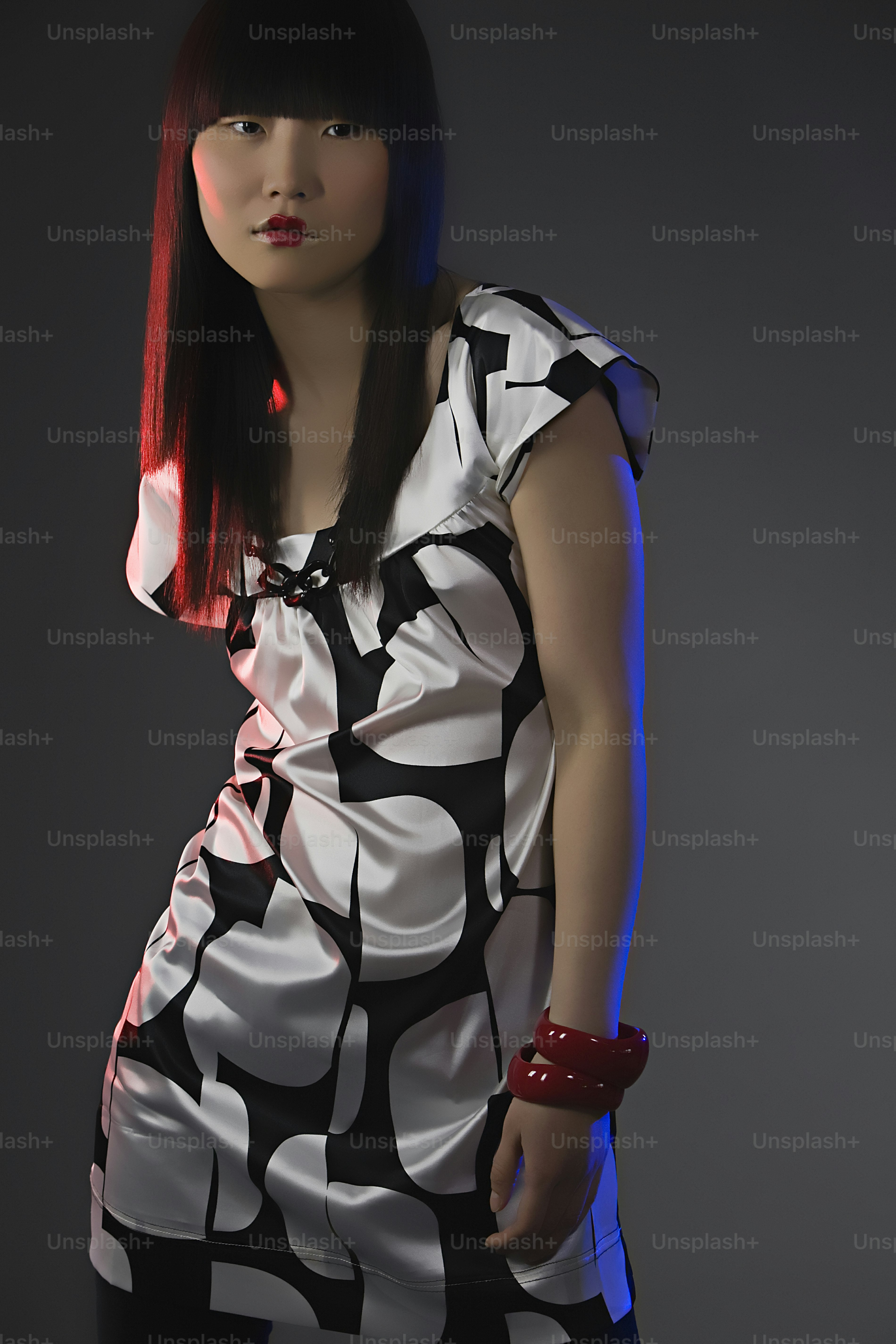 A woman with long hair wearing a colorful dress photo – Woman Image on ...