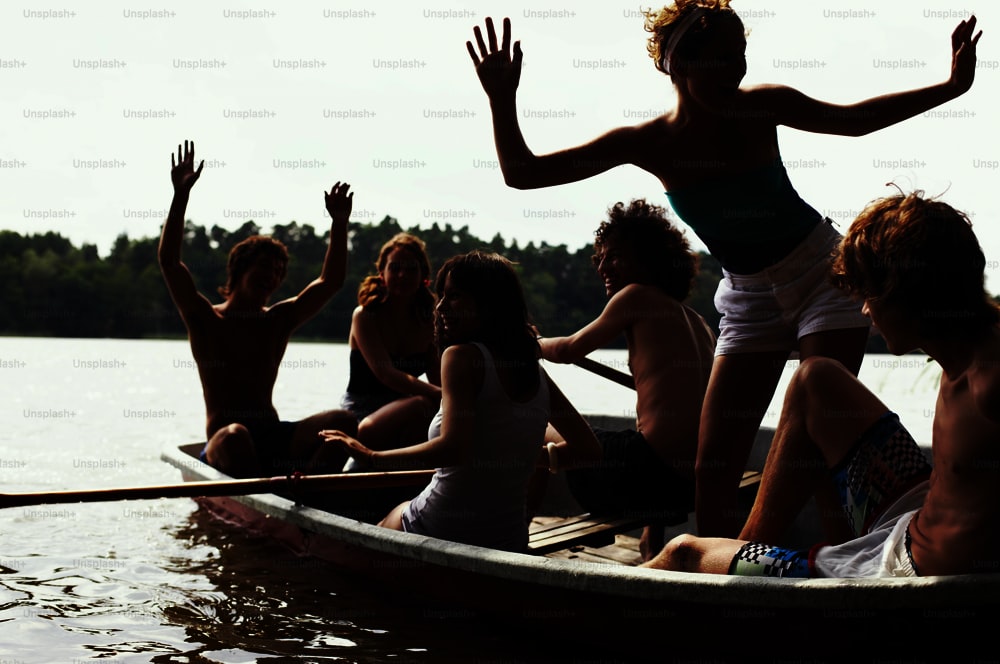 a group of people riding in a boat on a lake