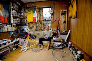 a man sitting on a couch in a living room