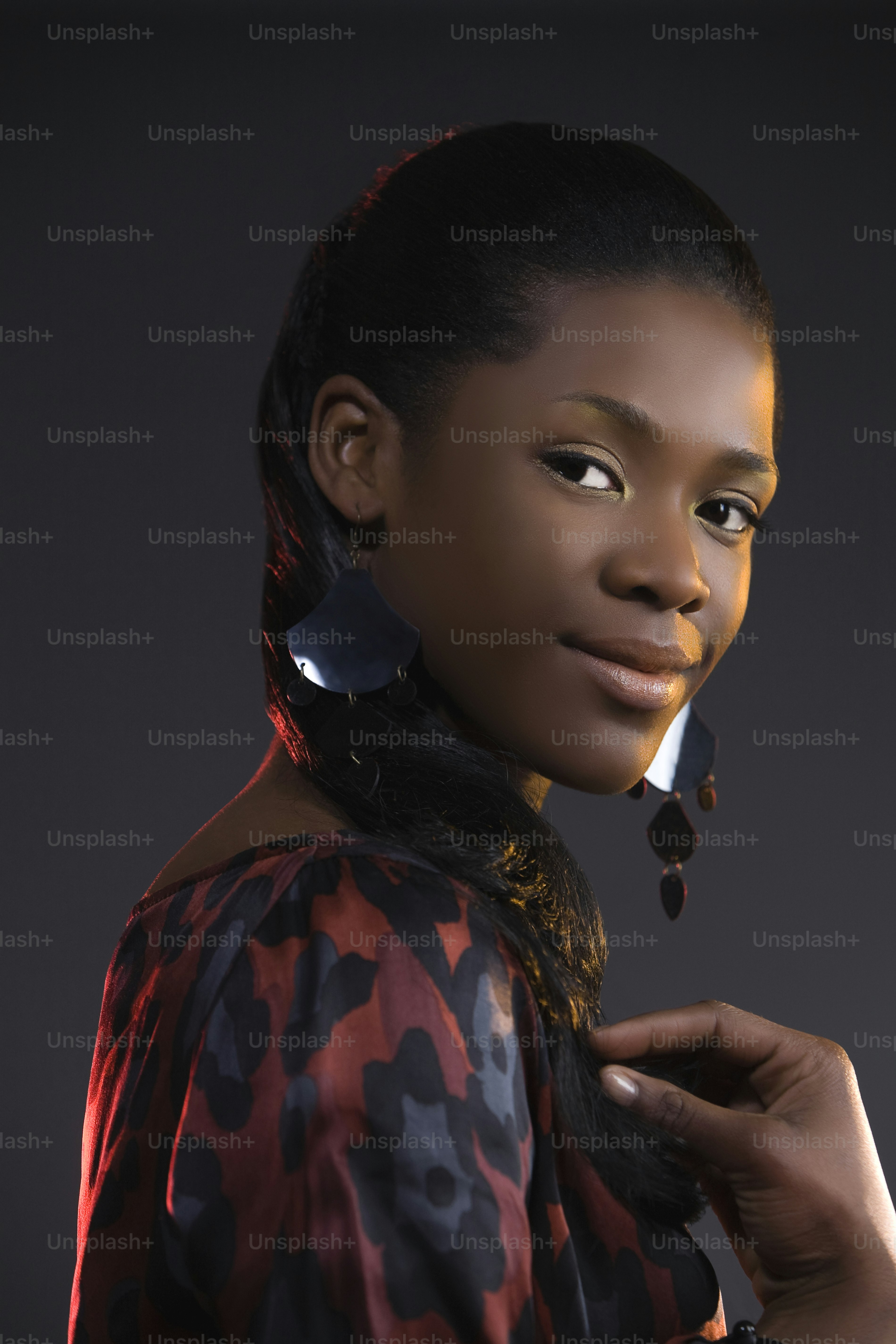 a woman with a pair of earrings on her ear