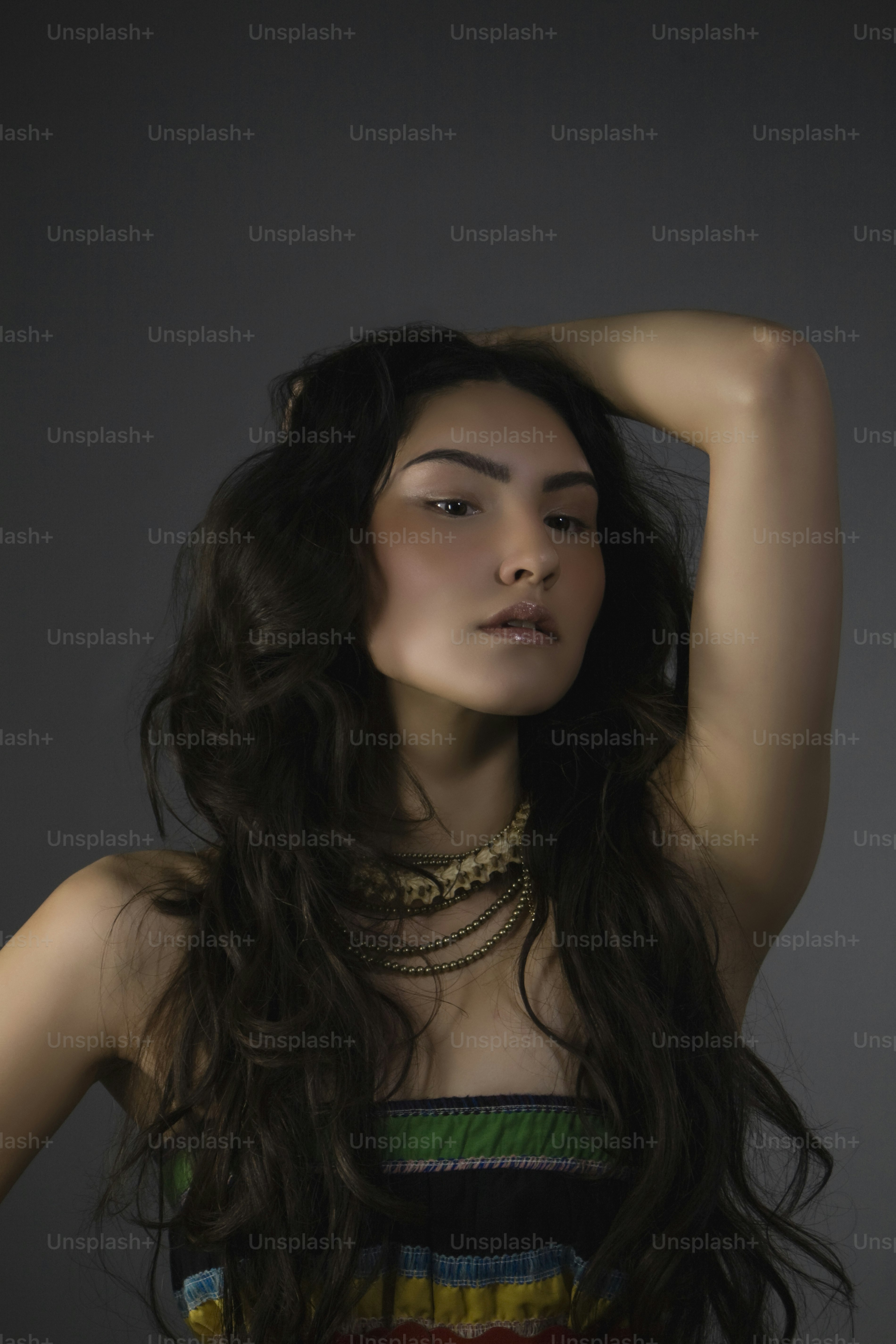 A woman with long hair wearing a colorful dress photo – Woman Image on ...