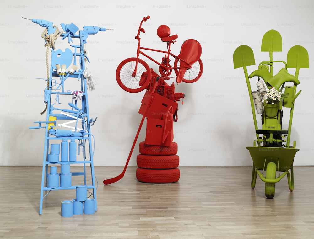 a group of three different colored bikes on a wooden floor