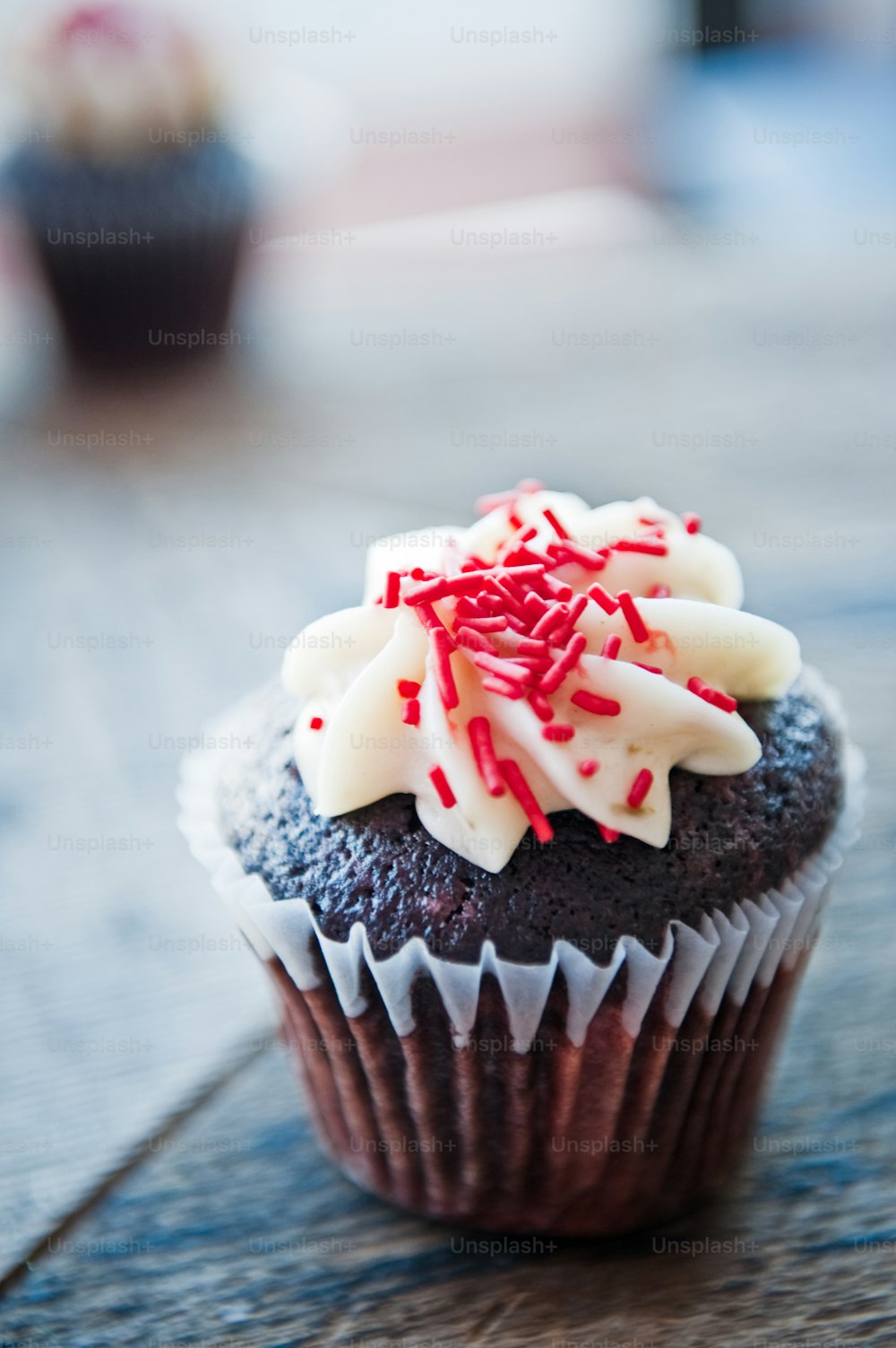 A cupcake with icing is seen