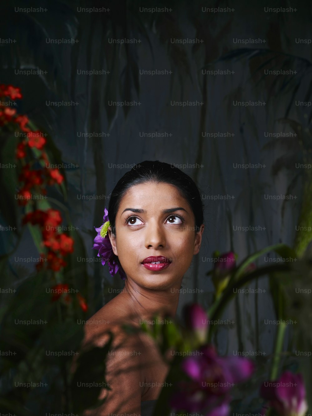 a woman with a flower in her hair