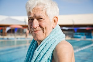 an older woman with a towel around her neck