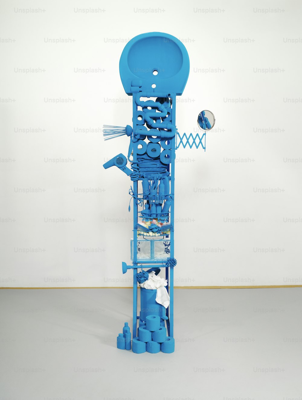 a sculpture made out of blue plastic pipes