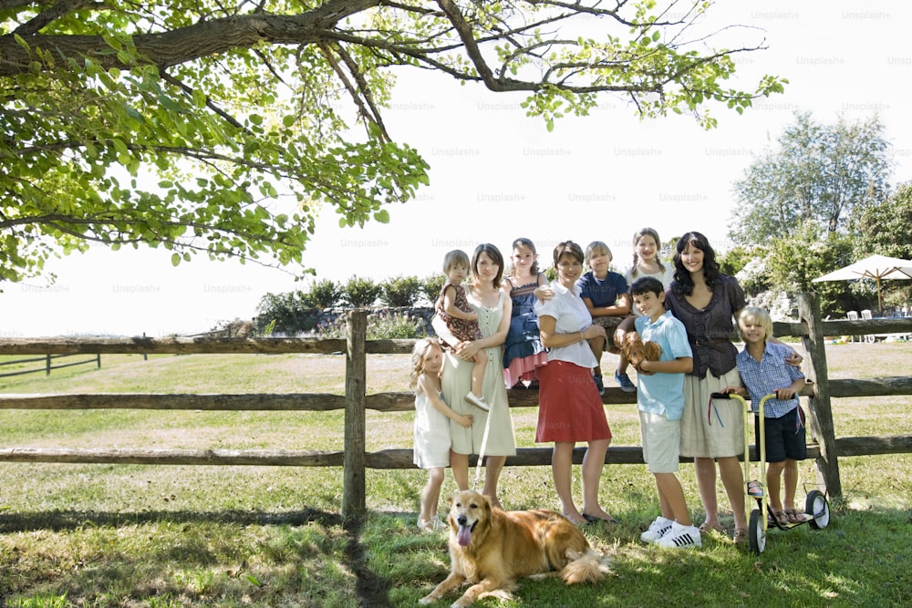 a group of people standing next to a dog