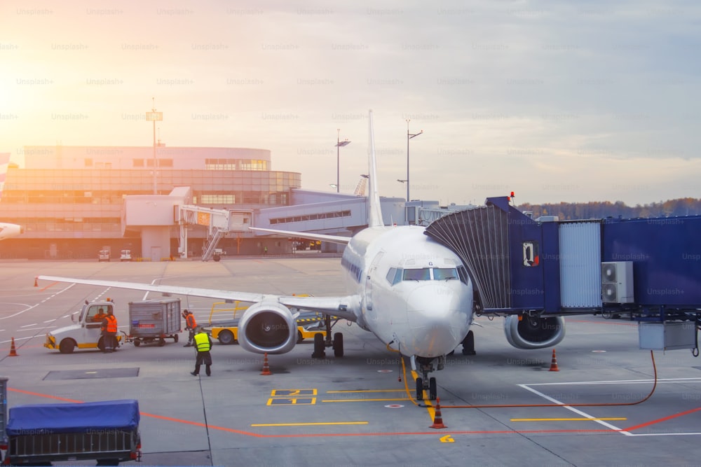 Airplane passenger gangway of the terminal building at the airport, aircraft flight maintenance