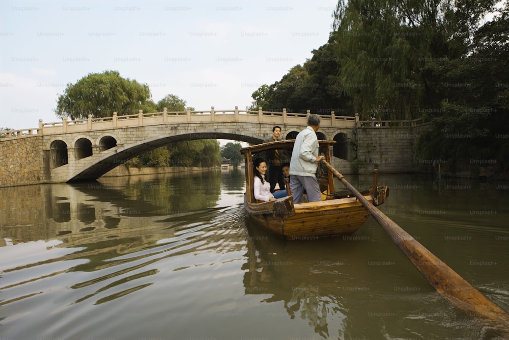 a man and a woman in a boat on a river