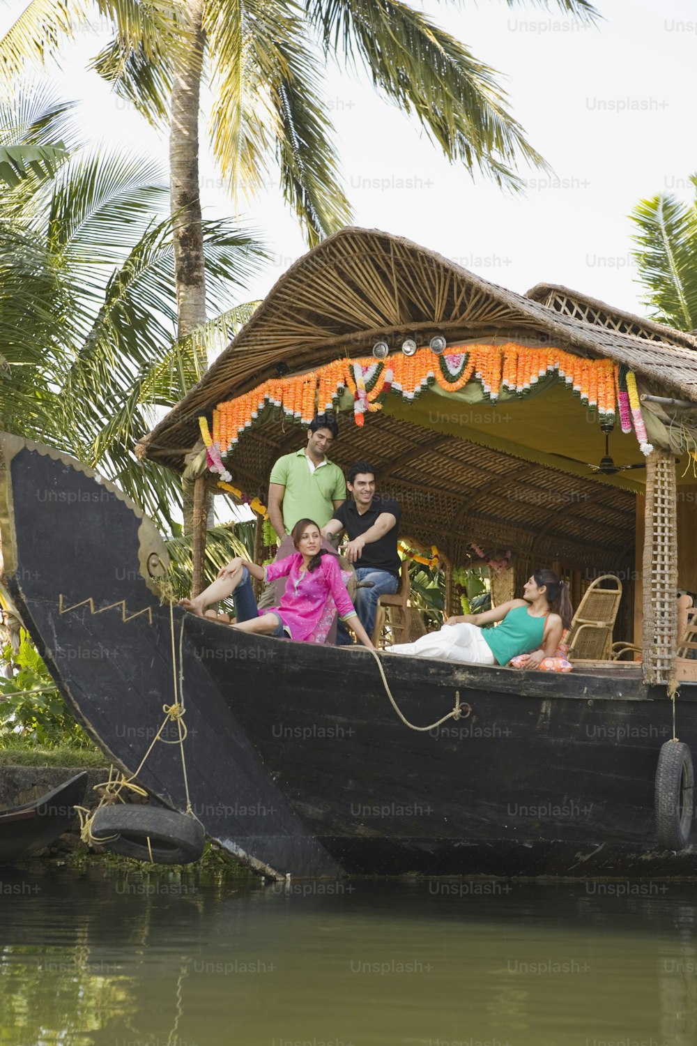 a group of people riding on the back of a boat