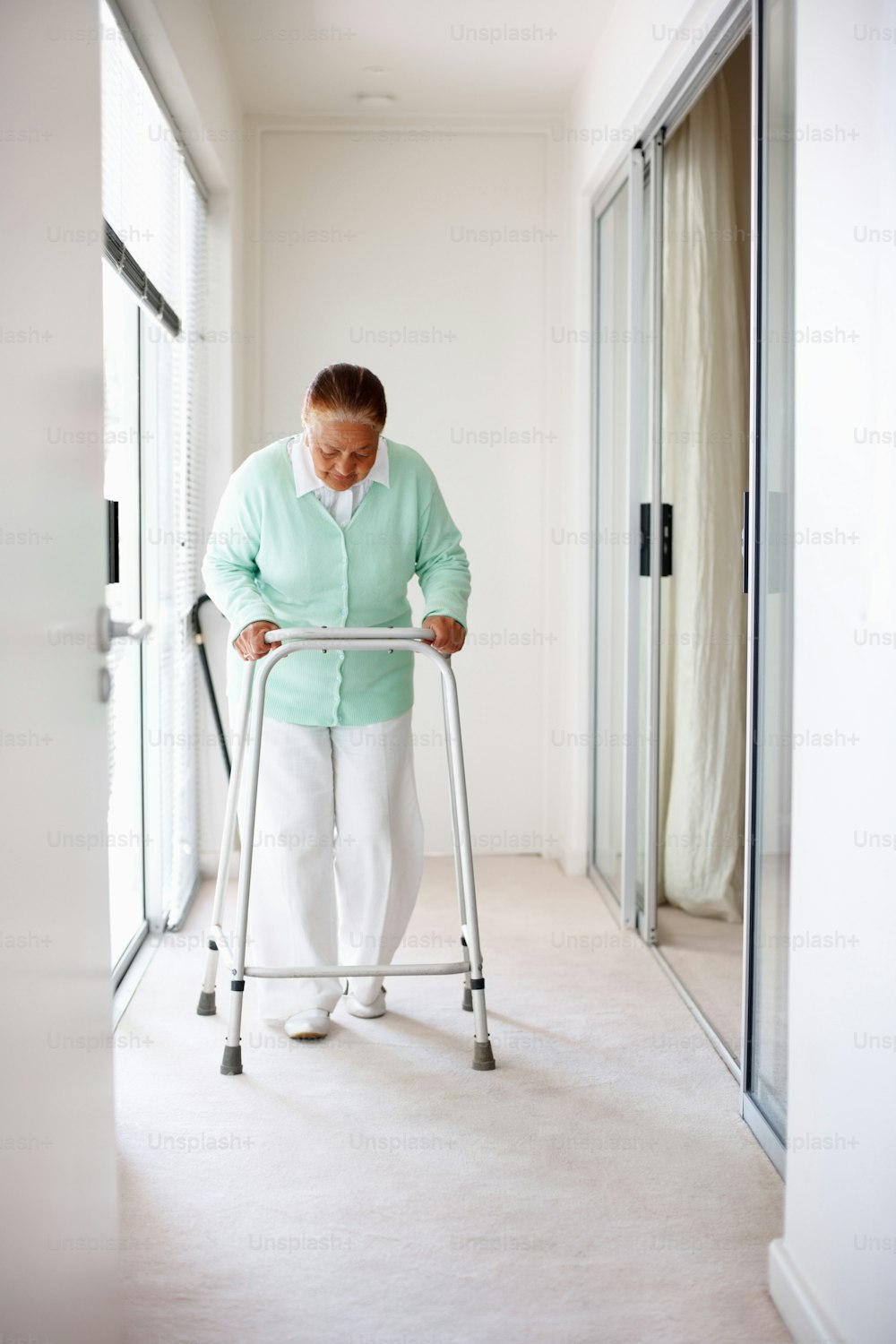 Elderly woman on a walker