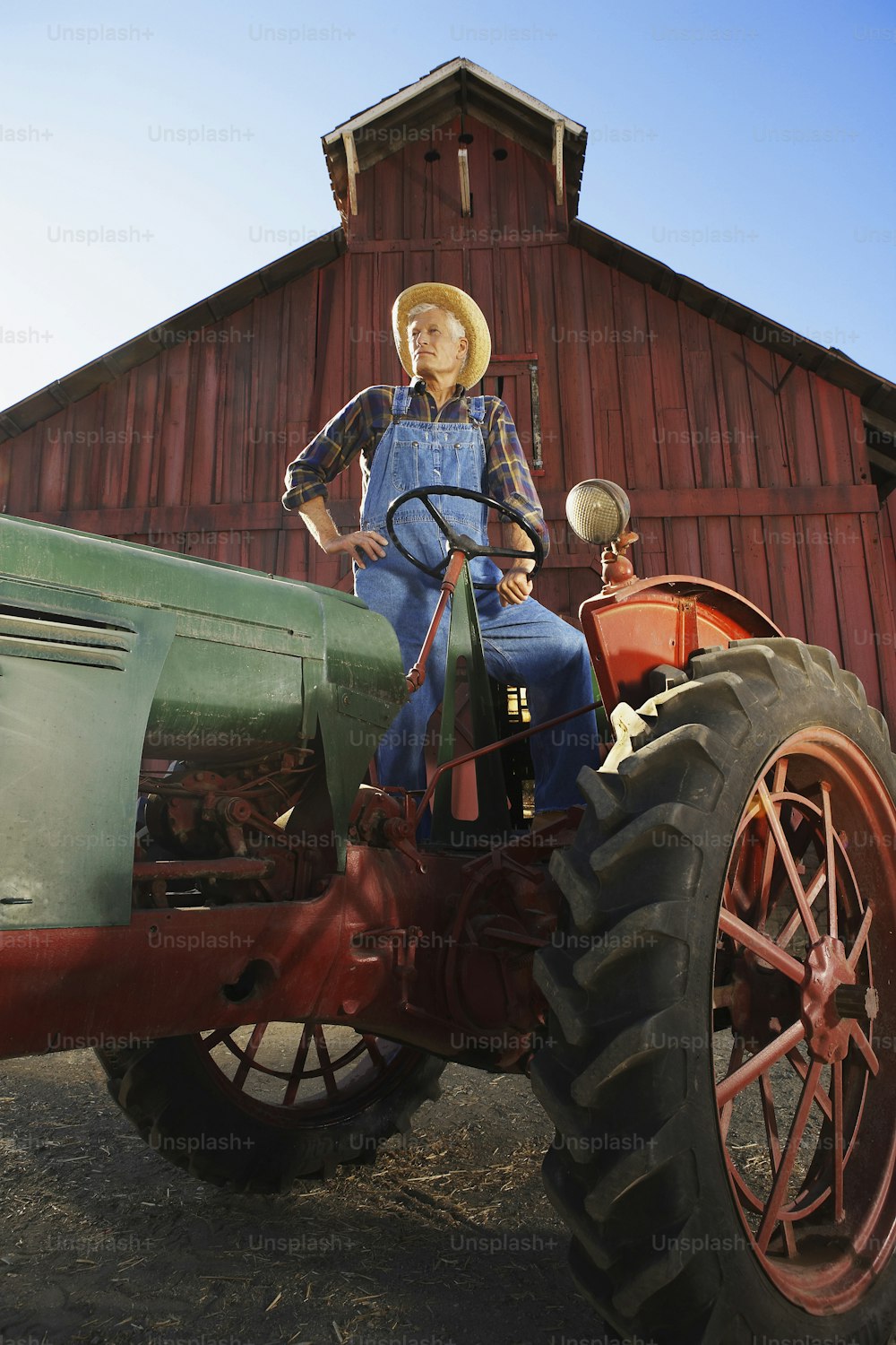 a woman standing on top of a tractor