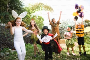a group of children dressed up in costumes