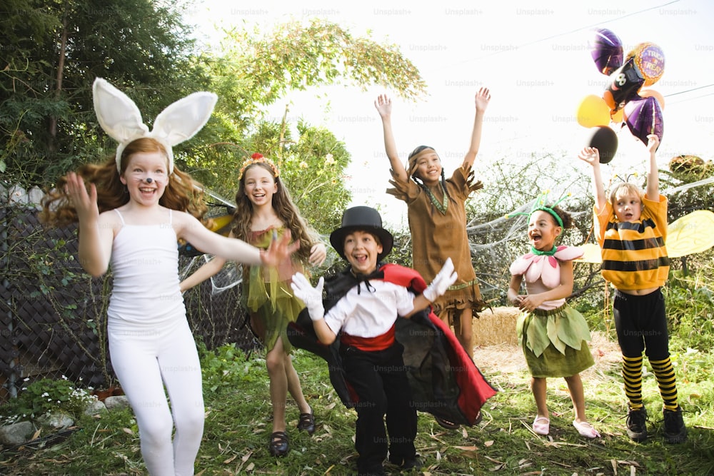 a group of children dressed up in costumes