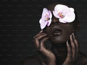 a woman with two orchids on her face