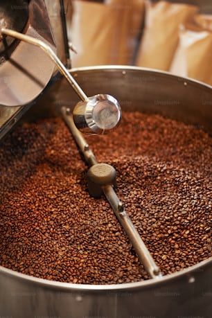 Roasting Coffee Beans In Coffee Shop. Coffee Frying Machine With Coffee Beans. High Resolution