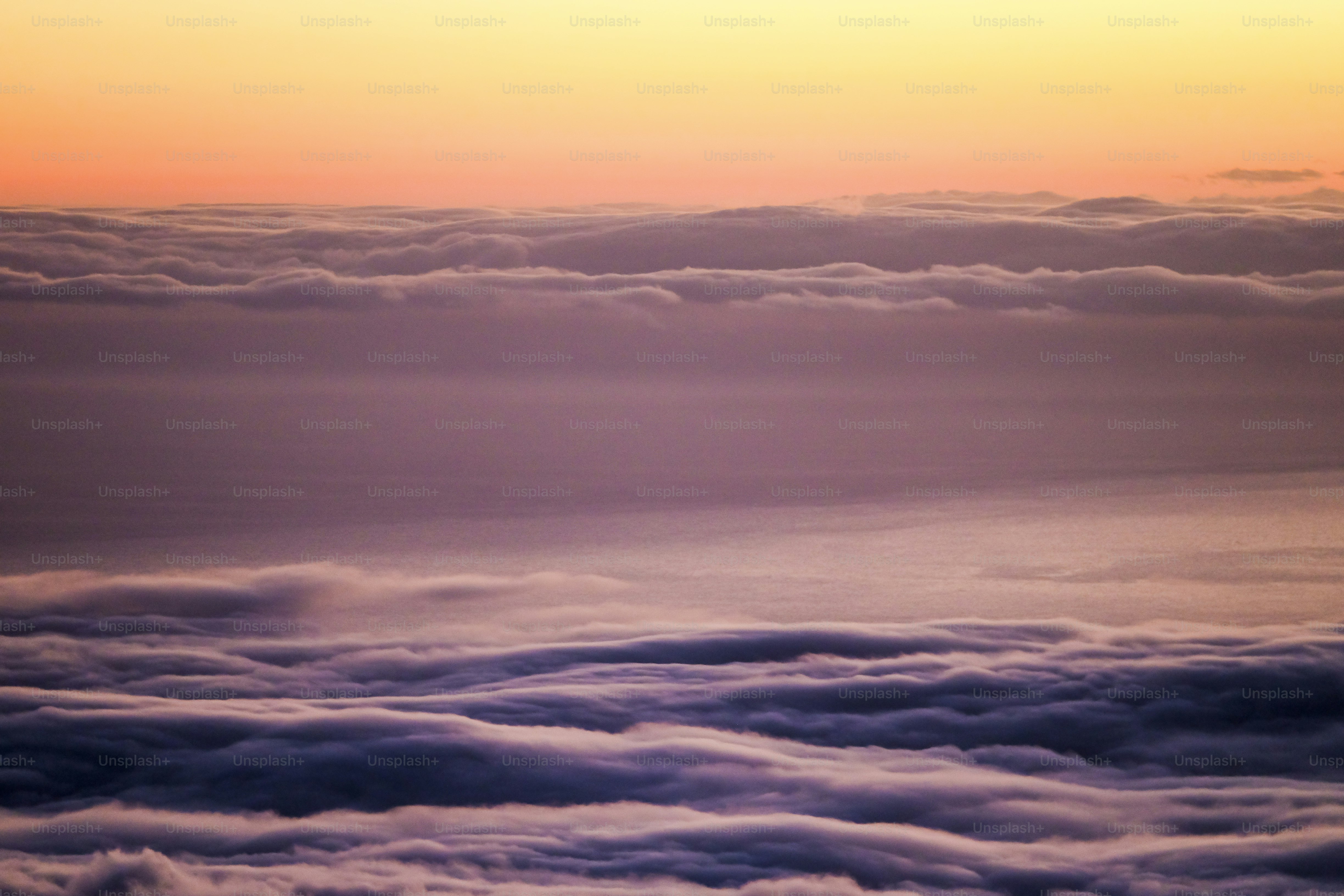 high view of sunset sundown in Tenerife El teide vulcan looking at La Gomera direction with clouds and ocean in warm colors. beautiful landscape quiet and silence scene