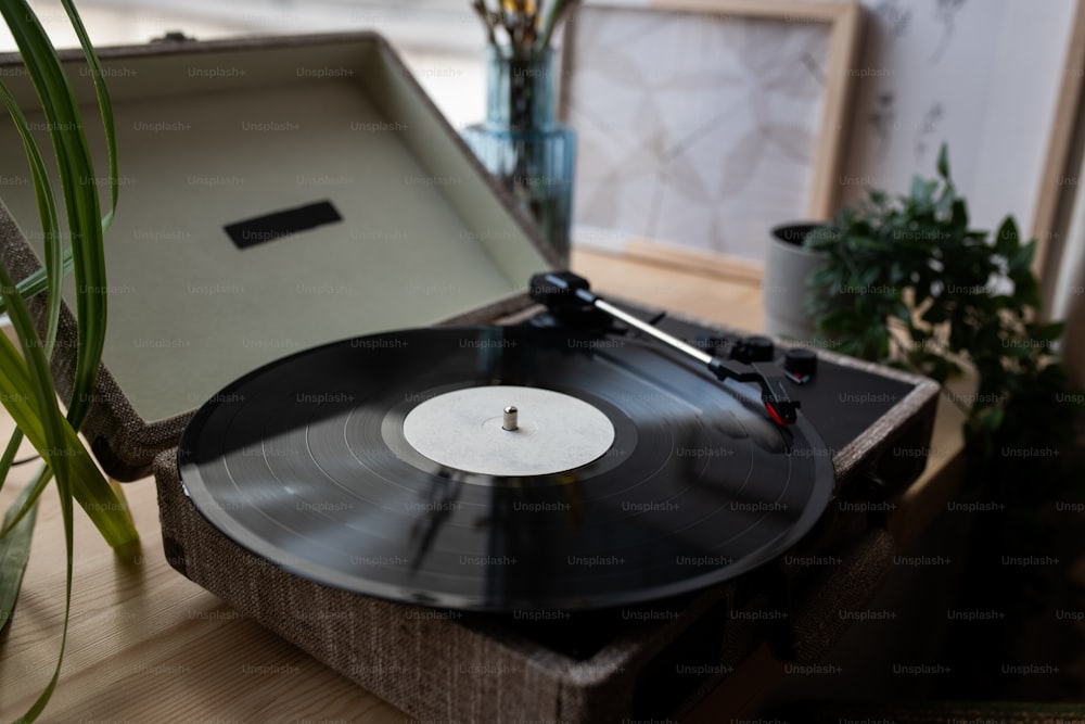 Horizontal no people still life shot of vinyl record player with phonograph record on windowsill at home