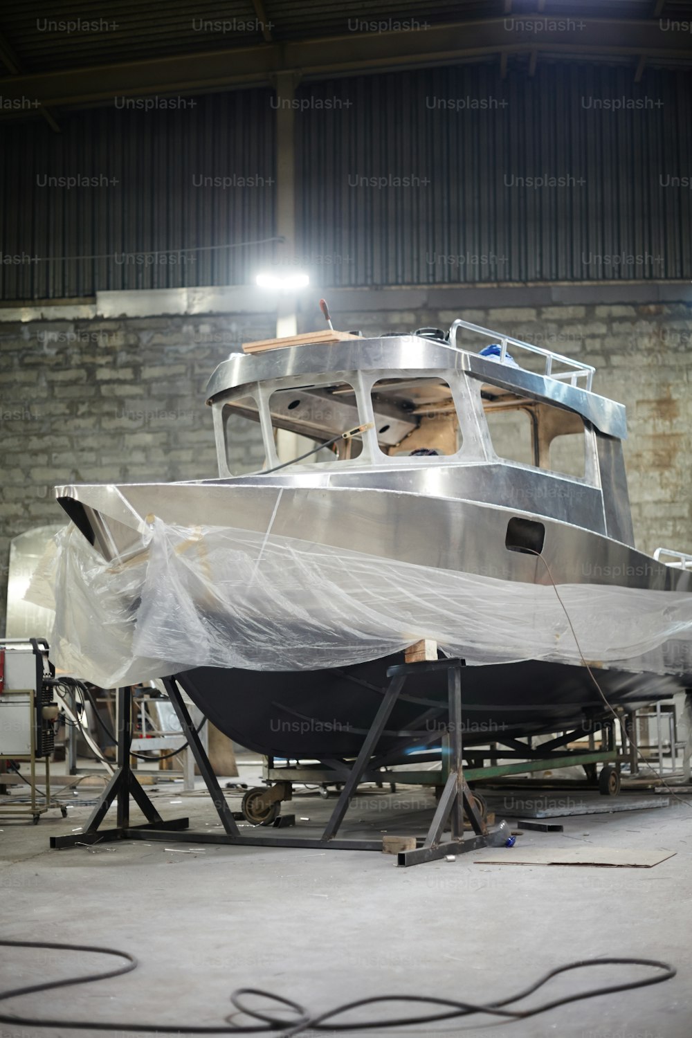 New empty metallic boat in hangar or shipyard built by modern engineers