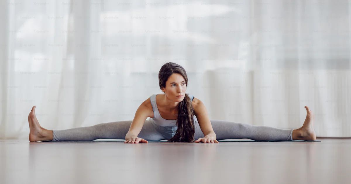 Young Attractive Brunette Sitting On The Mat With Spread Legs And young-attractive-brunette-sitting-on-the-mat-with-spread-legs-and