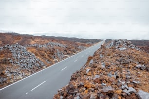 Beautiful straight road on the volcanic valley on Tenerife island, Spain