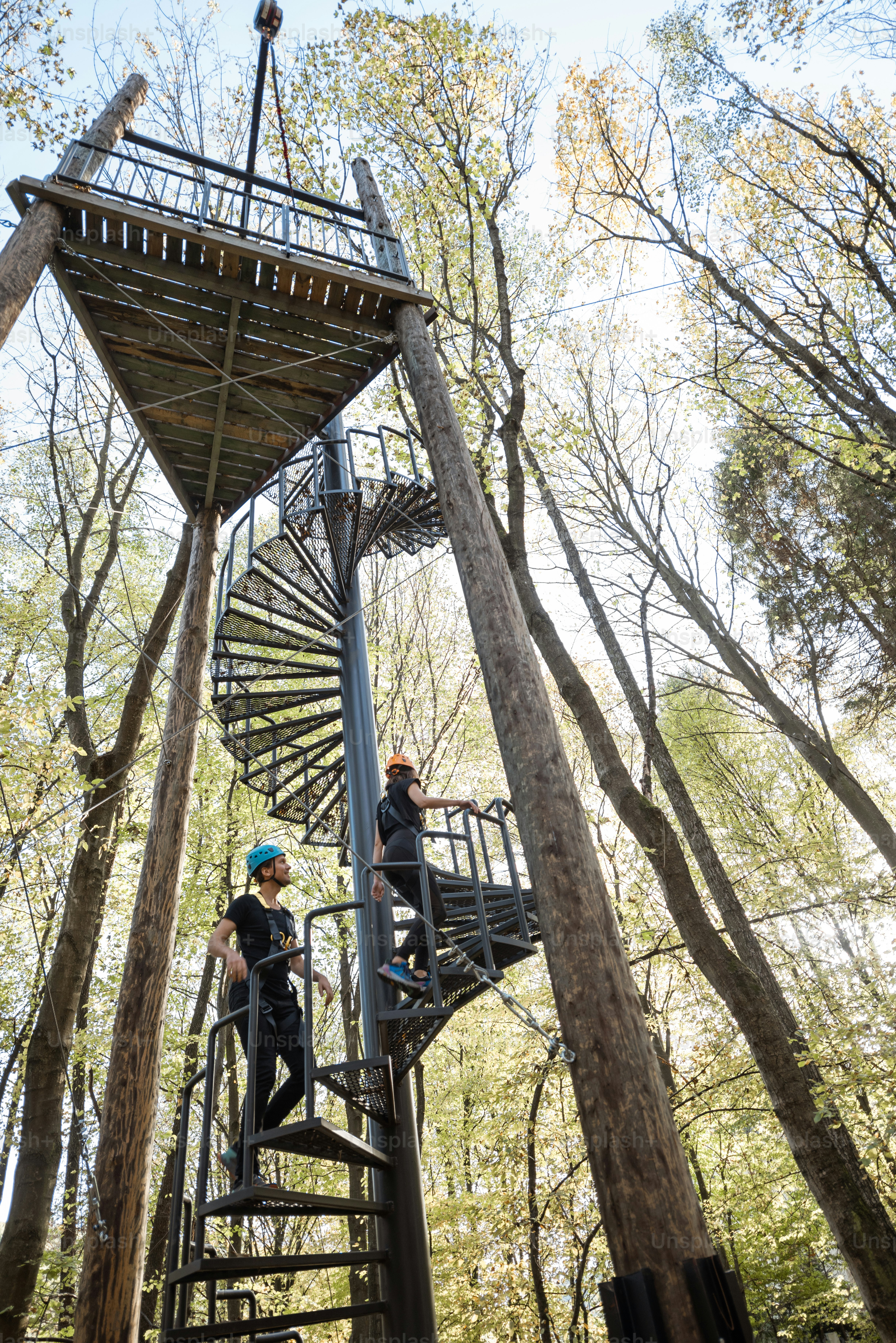 Rope Jumping tower with spiral staircase and people climbing up