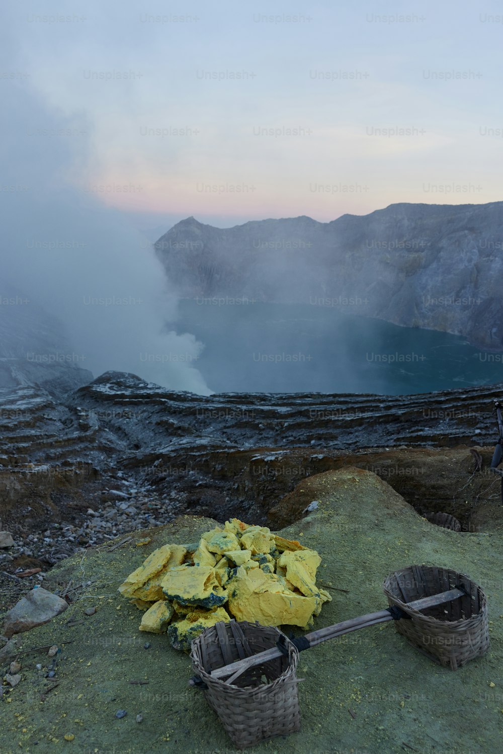 Sulfur carriers basket at Kawah Ijen, Indonesia. Heavy basket laden by pieces of natural sulfur to carry by miners from crater mine. Manual labour intensive sulphur mining operation in Kawah Ijen
