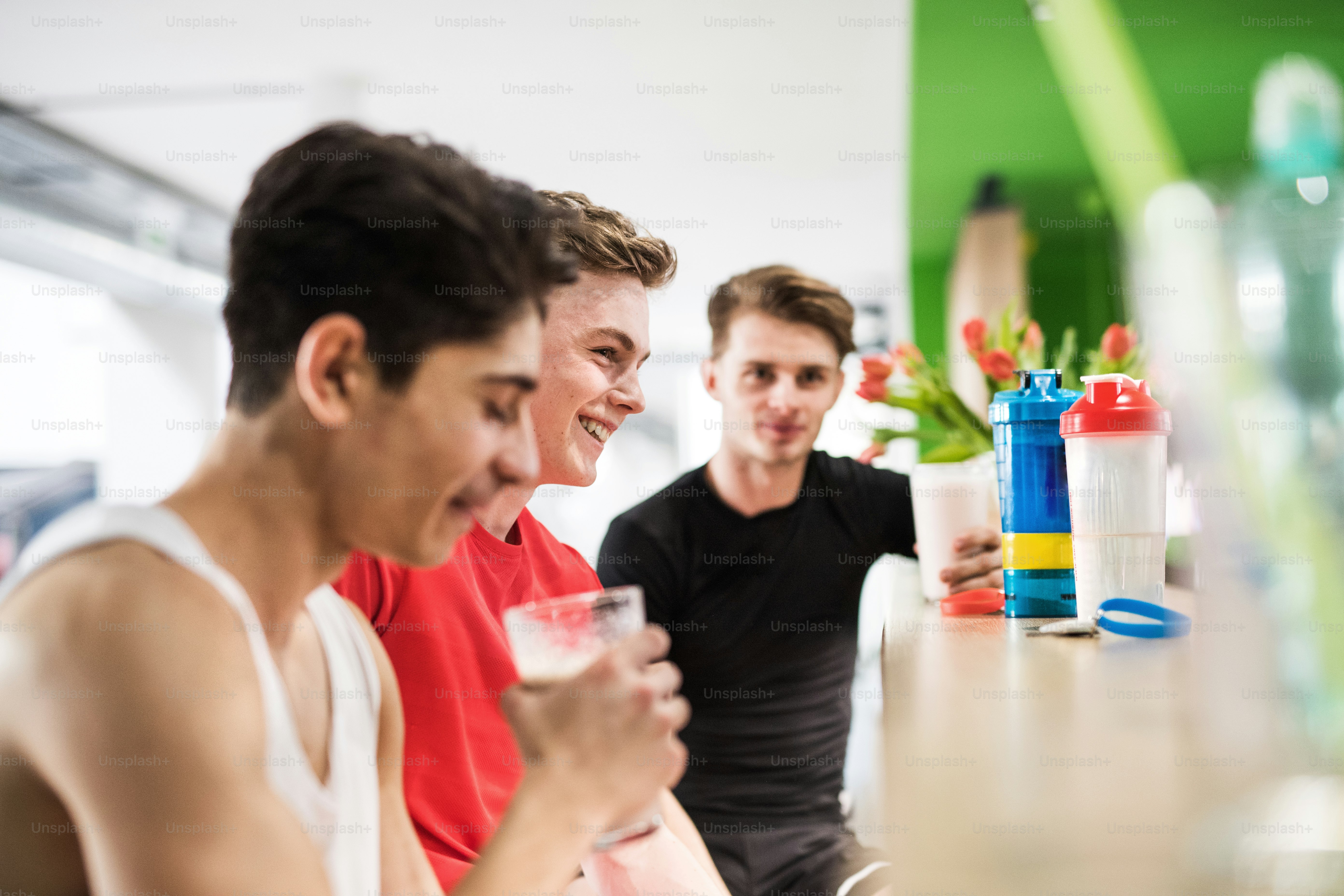 Men holding protein powders