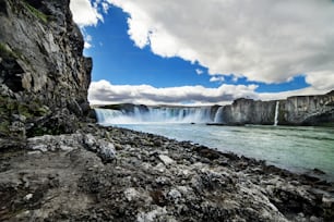 A waterfall in a beautiful rocky Iceland landscape, Europe.