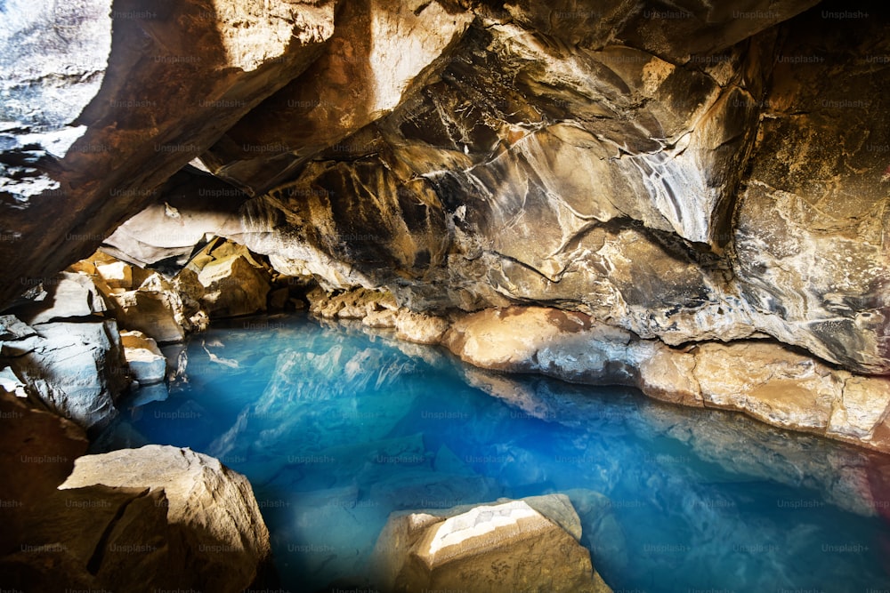 A cave filled with hot water in Iceland, Europe.