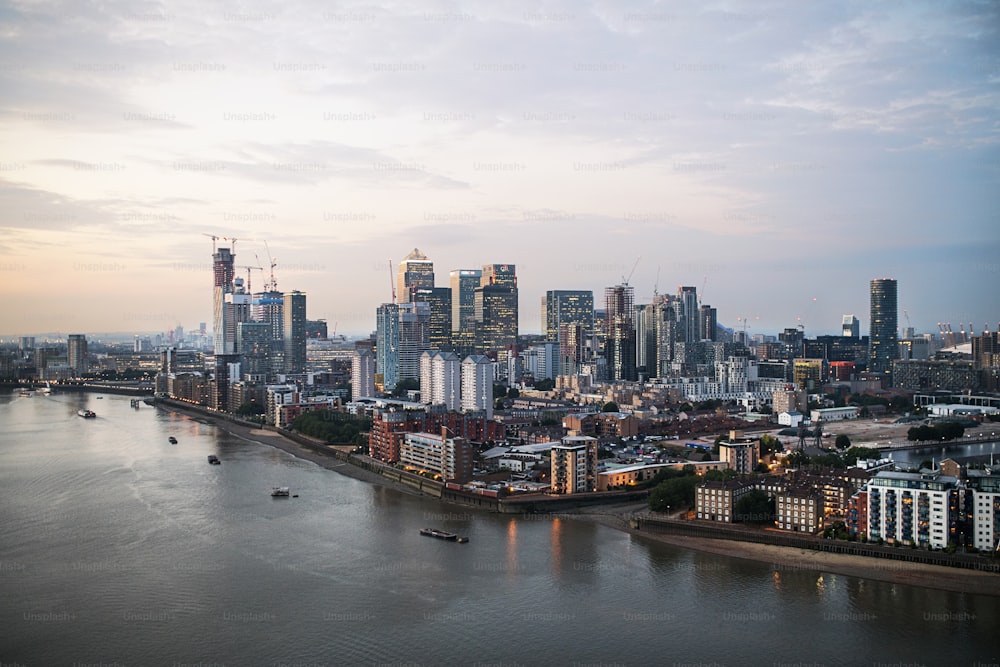 A dusk over a London skyline panorama with the river Thames.
