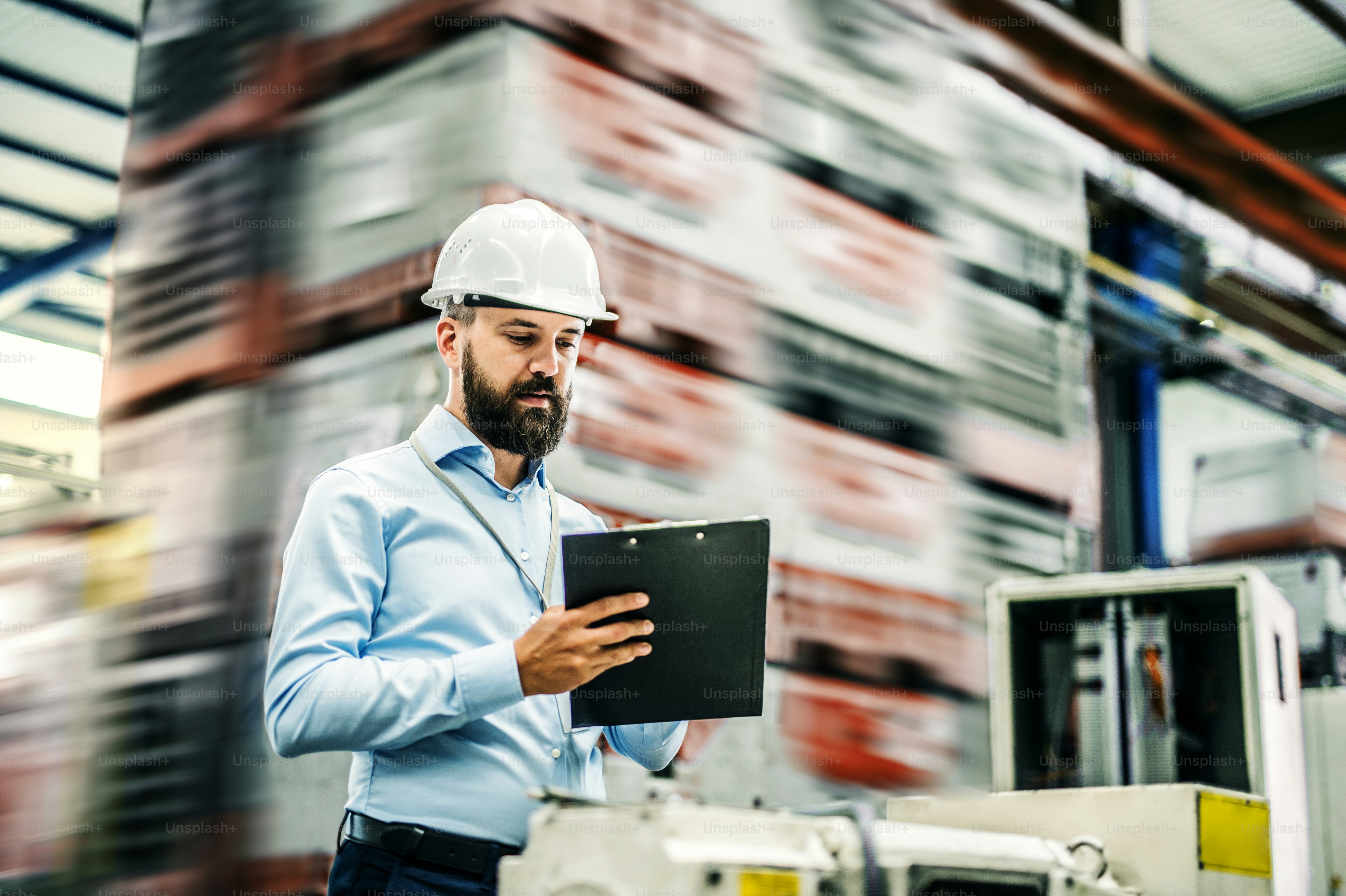 A Portrait Of A Mature Industrial Man Engineer With Clipboard In A ...