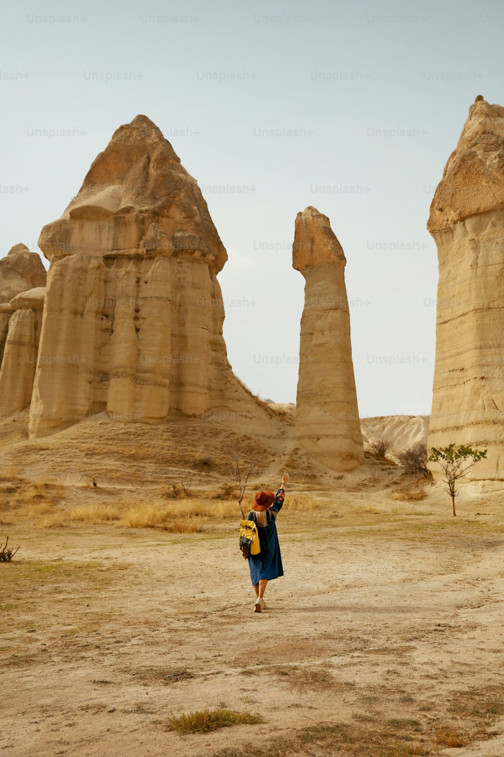 Travel. Woman Traveling At Stone Valley, Landscape Of Love Valley, Famous Turkey Landmark. High Resolution