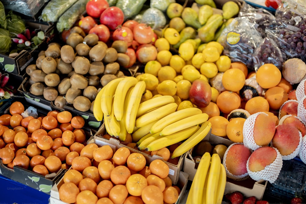 Variety of fresh fruits on the market counter, close-up