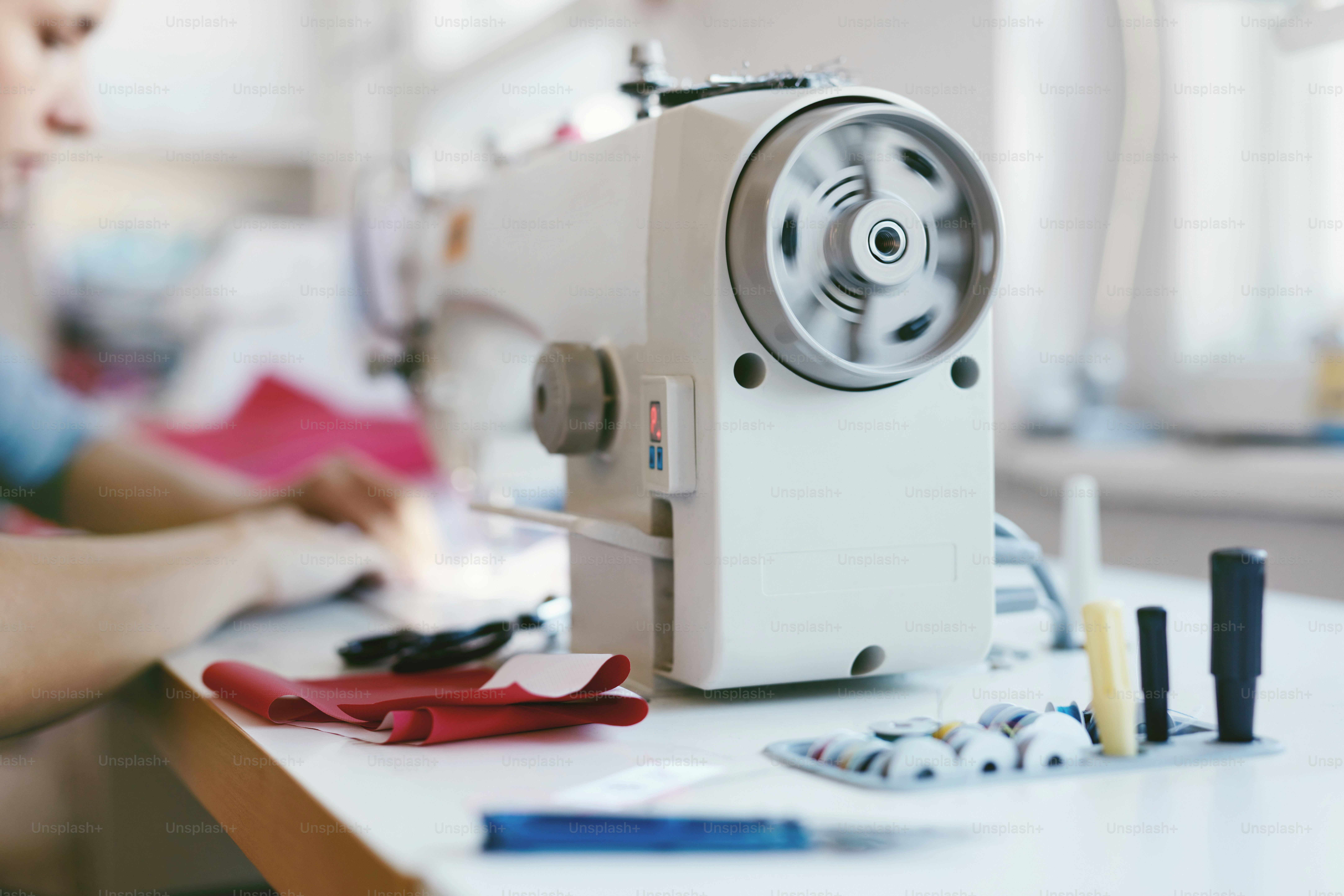 Close Up Of Female Working On Sewing Machine, Using Sewing Patterns ...