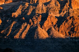 warm sunset on the rocky mountains in el Teide national park in Tenerife. beautiful wallpaper with mounts red and orange and shadow