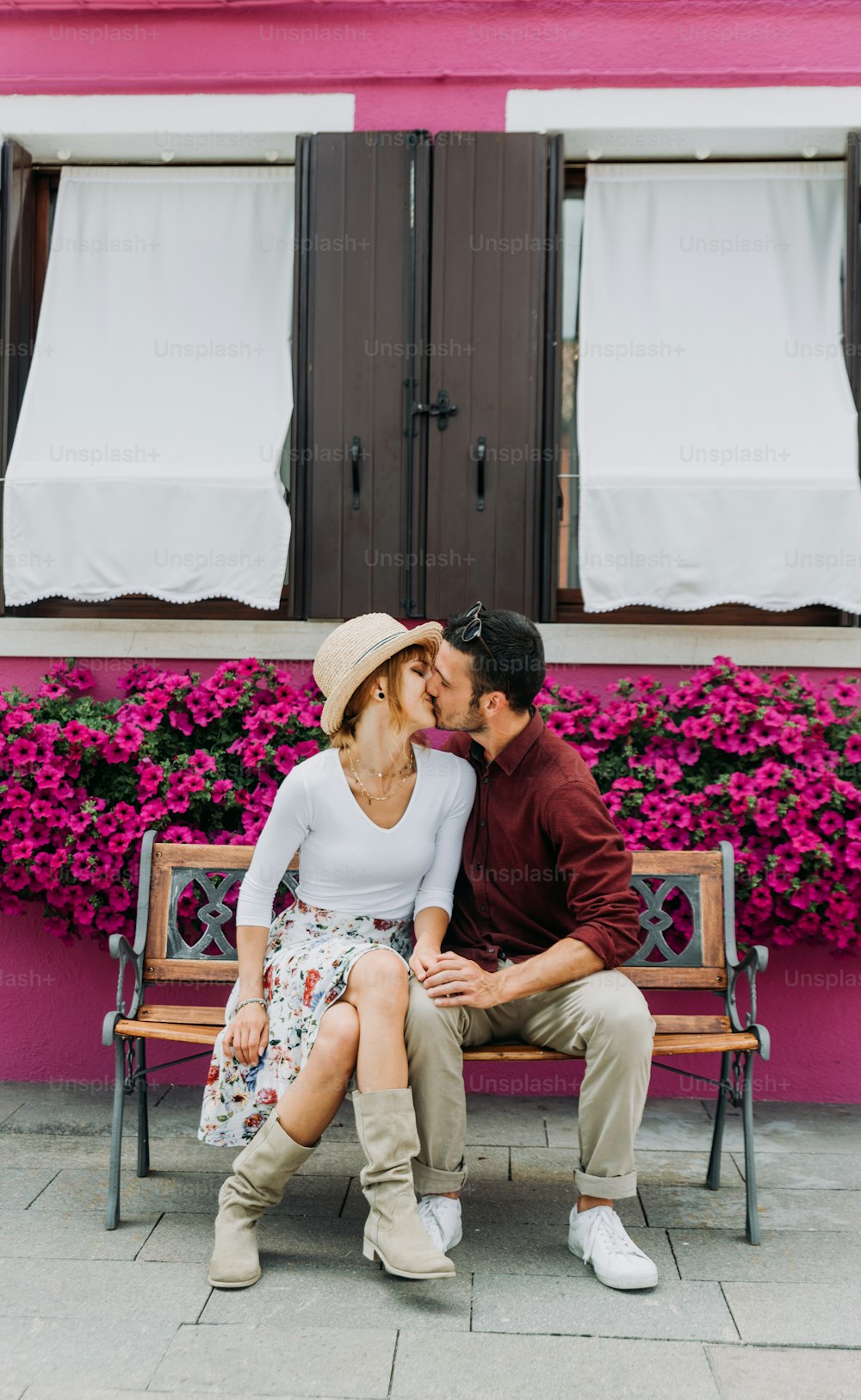 Romantic couple kissing in Venice, Italy. Boyfriend and girlfriend visiting Burano.