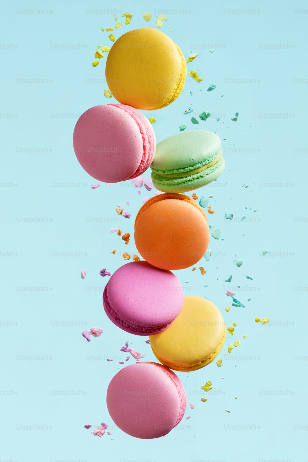 Macaron Dessert. Colorful Macaroons Flying. French Dessert In Motion Falling On Blue Background. High Resolution