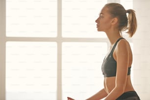 Portrait of female hands gesture mudra, while doing yoga vinyasa flow, Padmasana, nirvana state of mind