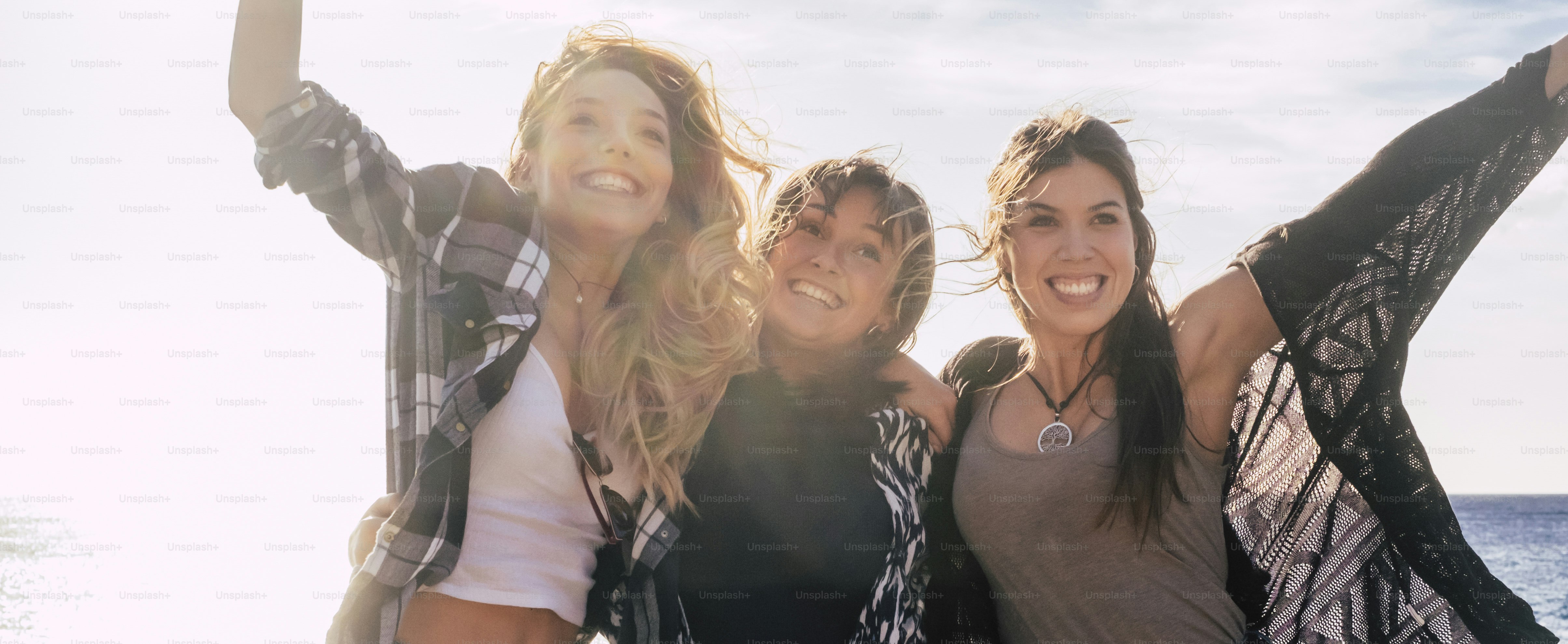 Happiness and joyful for three young girls friends having fun together outdoor - friendship and together youth people smile and laugh - beautiful attractive females and white background